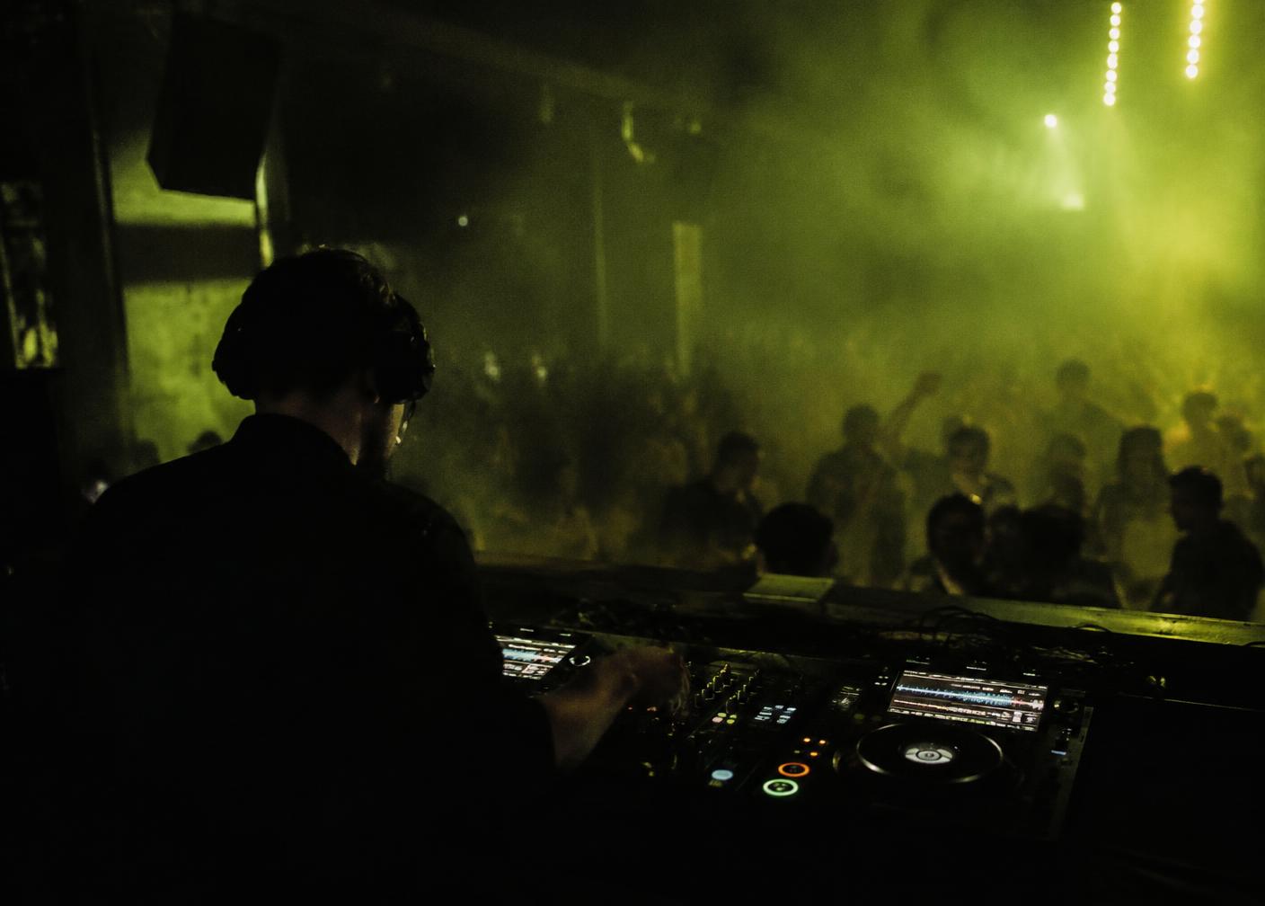 DJ booth in a smoke-filled room